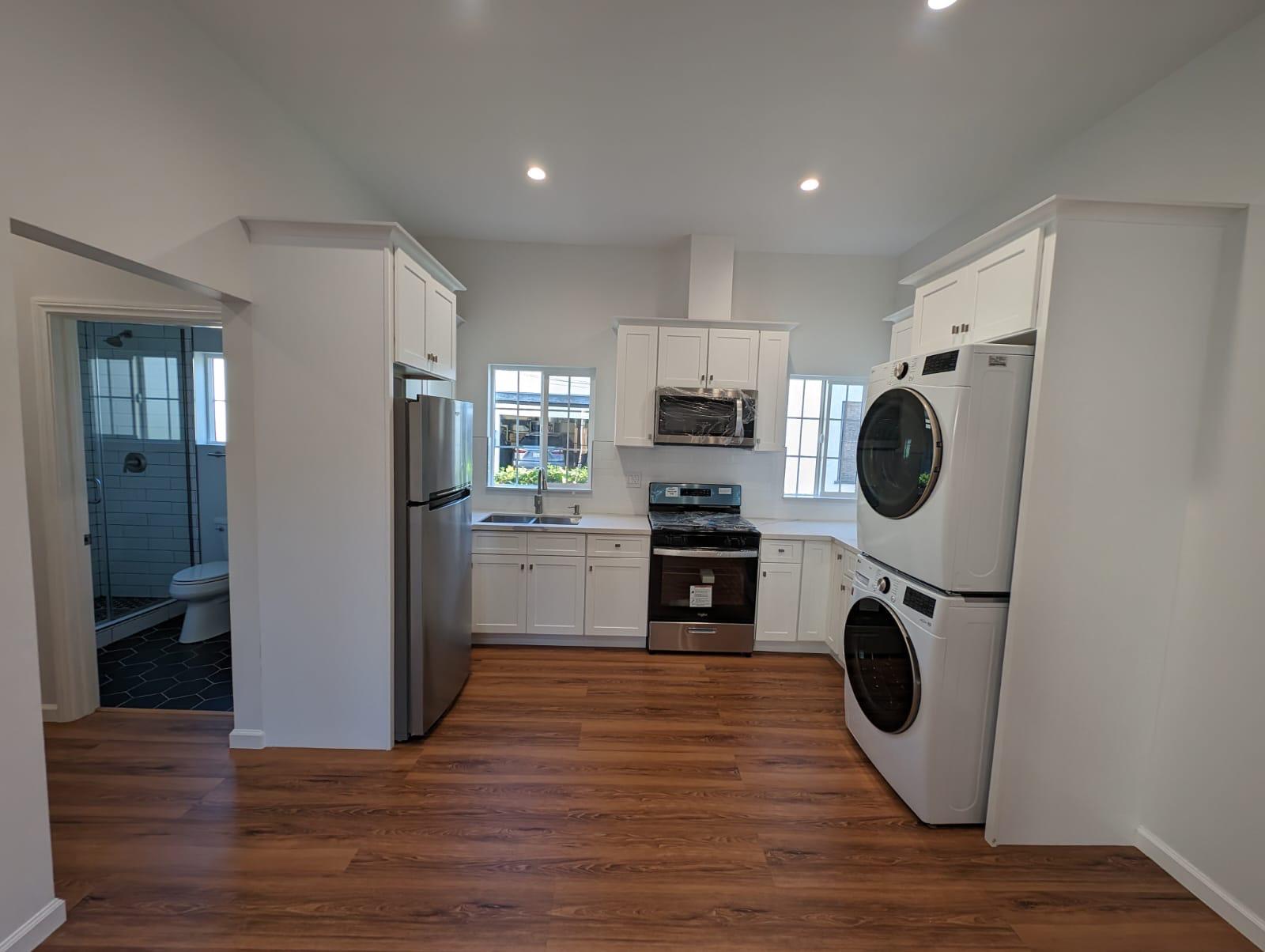 Compact junior ADU interior with efficiency kitchen in Los Angeles